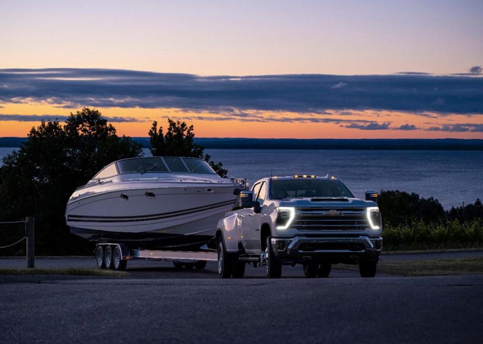 A front view of a Chevrolet Silverado 3500HD towing a boat.