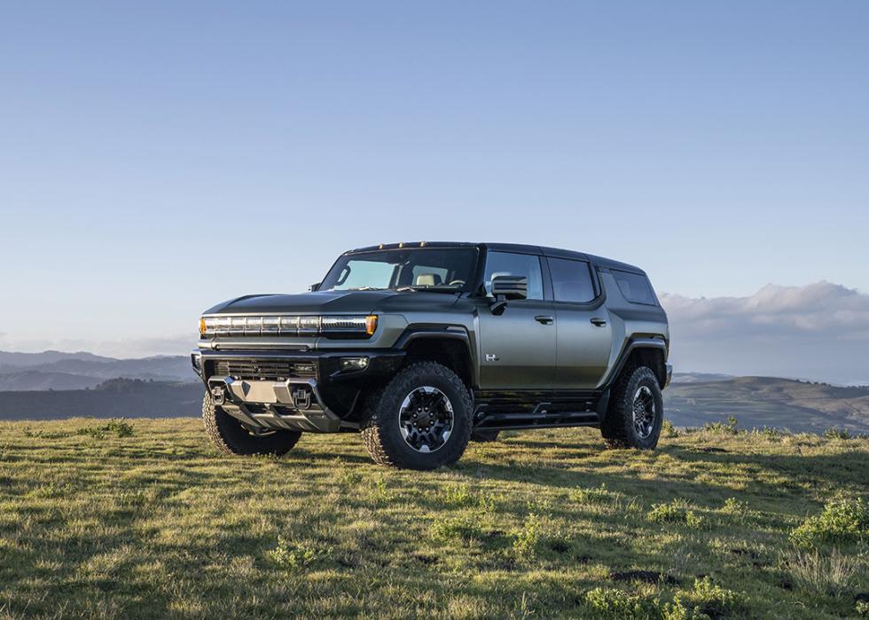 A 2025 GMC Hummer parked on a grassy field.