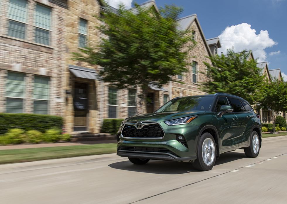 A 2025 green Toyota Highlander on the road.