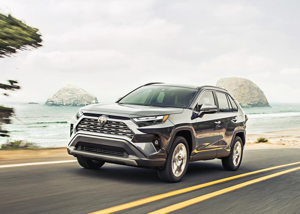 A black 2025 Toyota RAV4 on the road.