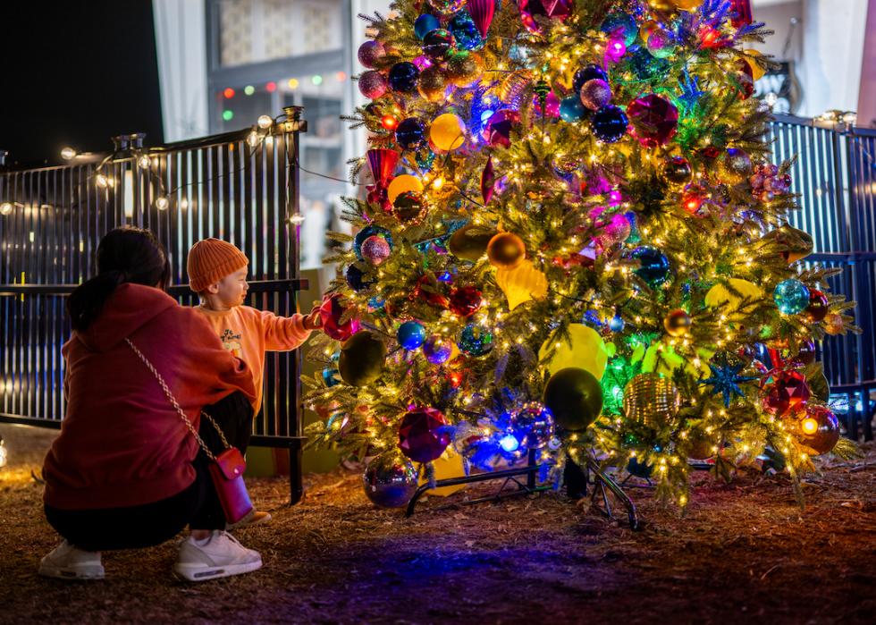 A family at the Austin Trail of Lights festival at Zilker Metropolitan Park on Dec. 14, 2023 in Austin, Texas. 