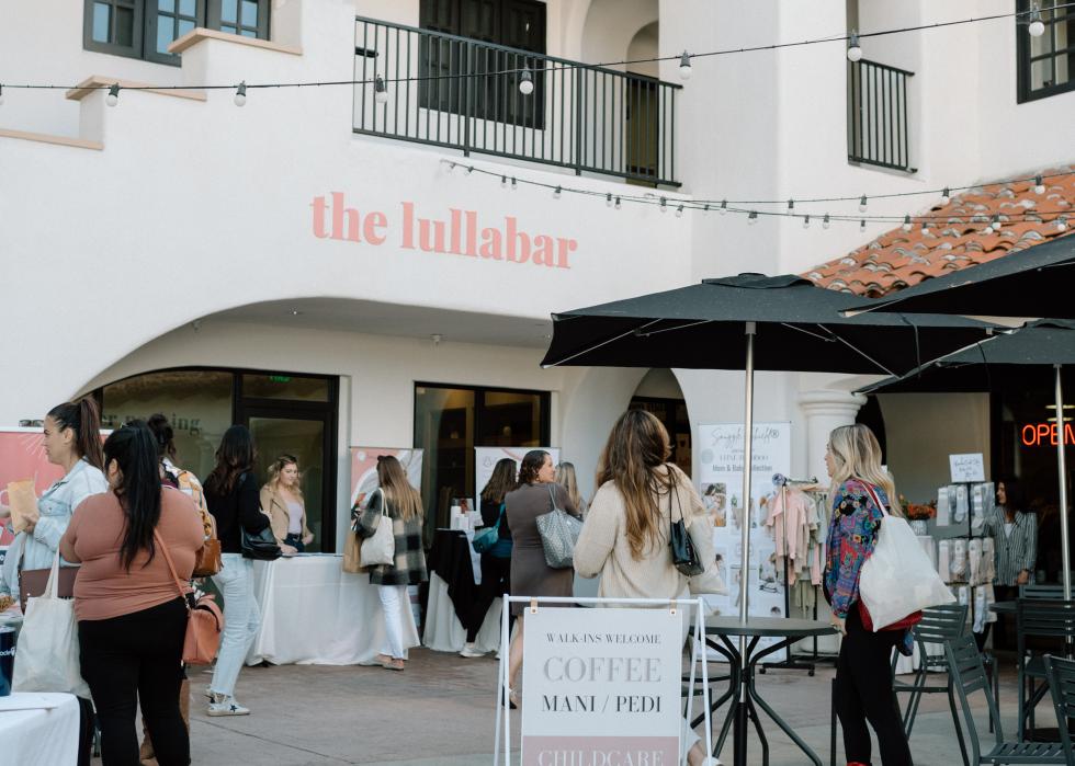 Exterior of The Lullabar with many customers walking in.