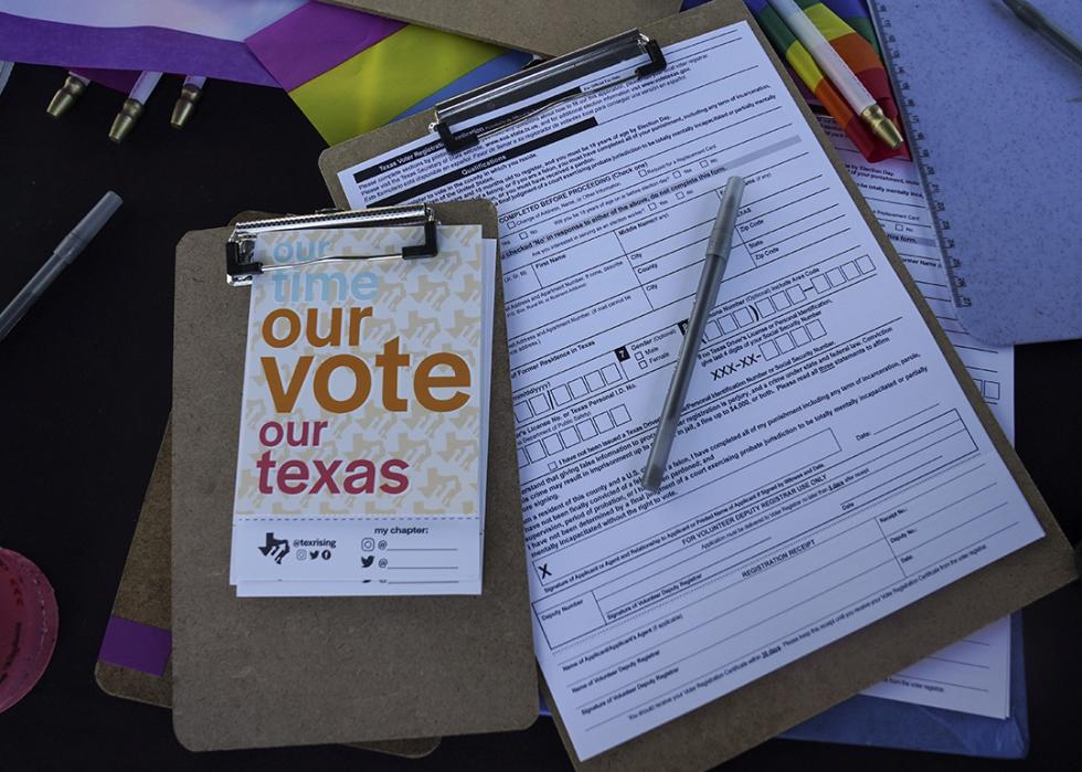 Applications to register to vote are seen at the Texas Rising tent during a Pride celebration in Corpus Christi, Texas on Oct. 5, 2024. 