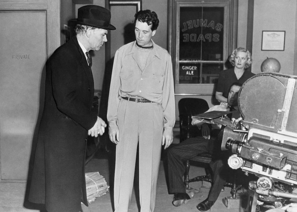 Walter and John Huston on the 'Maltese Falcon' set.