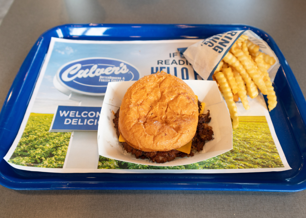 Culver's Fast Food Restaurant butter burger with french fries on a tray