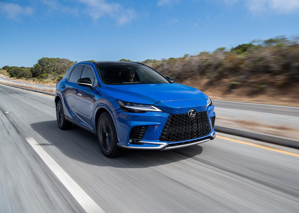 A blue 2025 Lexus RX on the road.