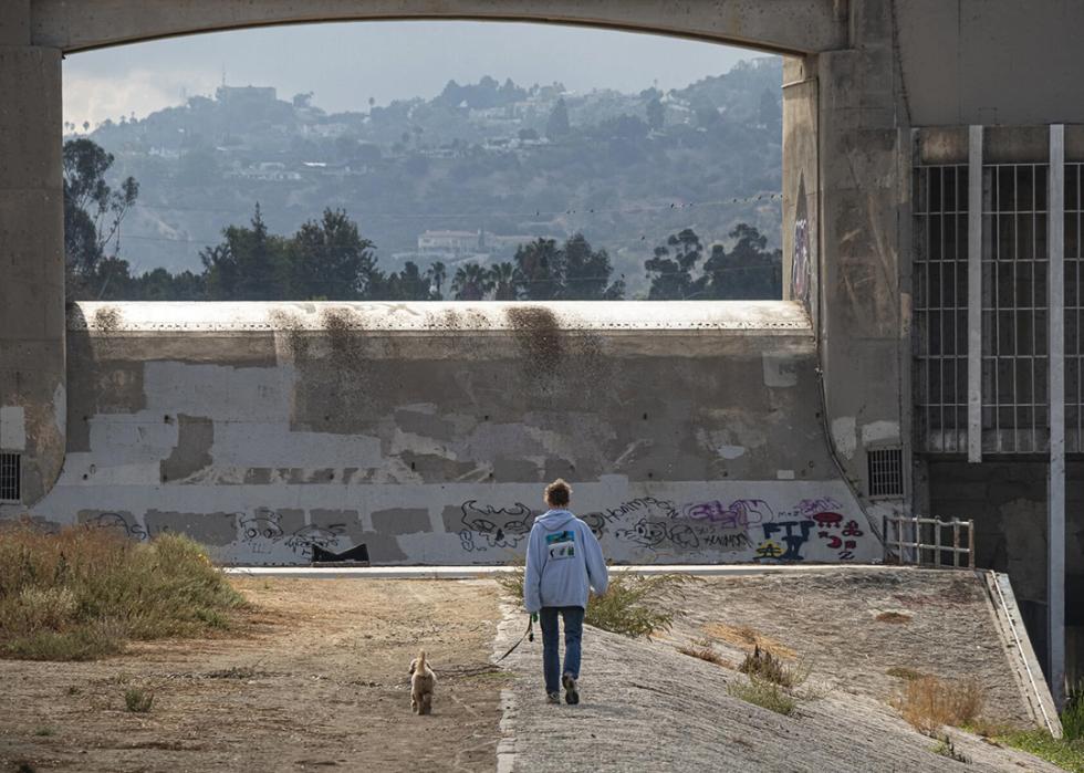 Melanie Winter and her dog Maisie at the Sepulveda Dam.