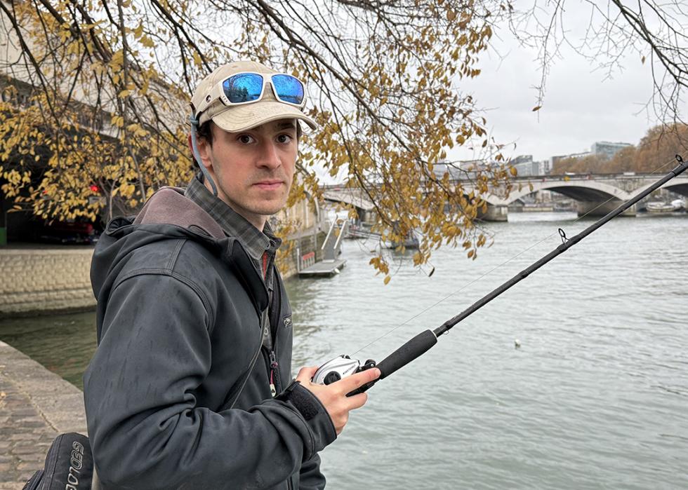 Bill François photographed fishing by the river Seine.