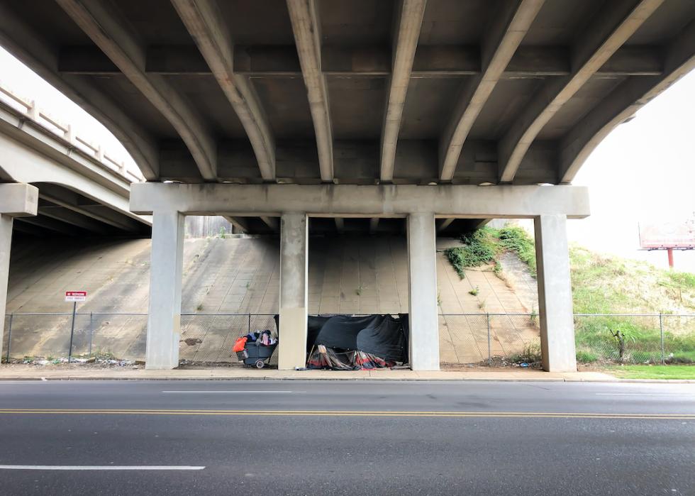 Homeless person has set up a tent and shelter underneath an underpass in Alabama.