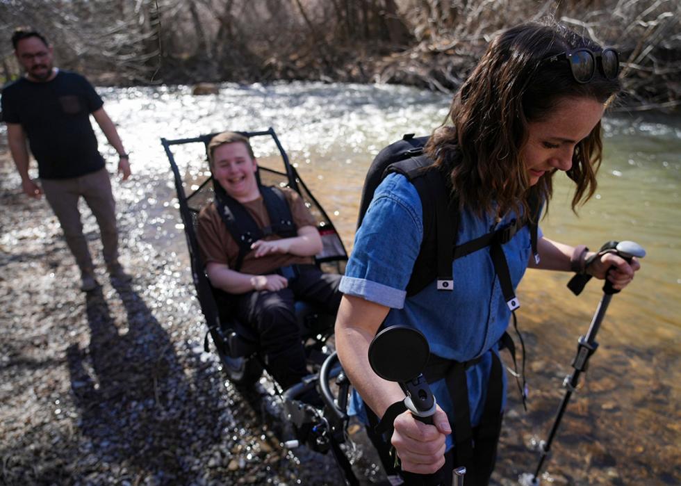 Emily Tingey pulls her son Phippin Tingey on a trail outside Logan.