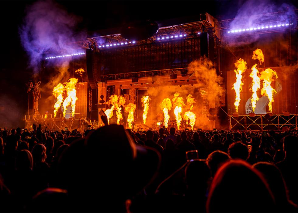 A view of the crowd and Post Malone's fiery stage at Rice-Eccles Stadium.