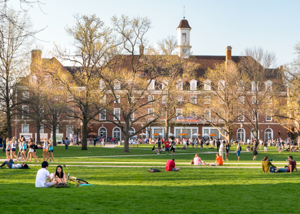 Students are out on the Quad lawn of University of Illinois college campus.