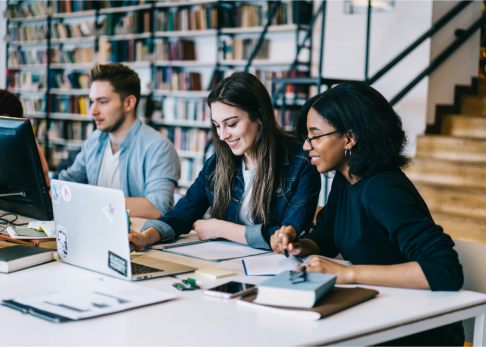 Students study together in library.