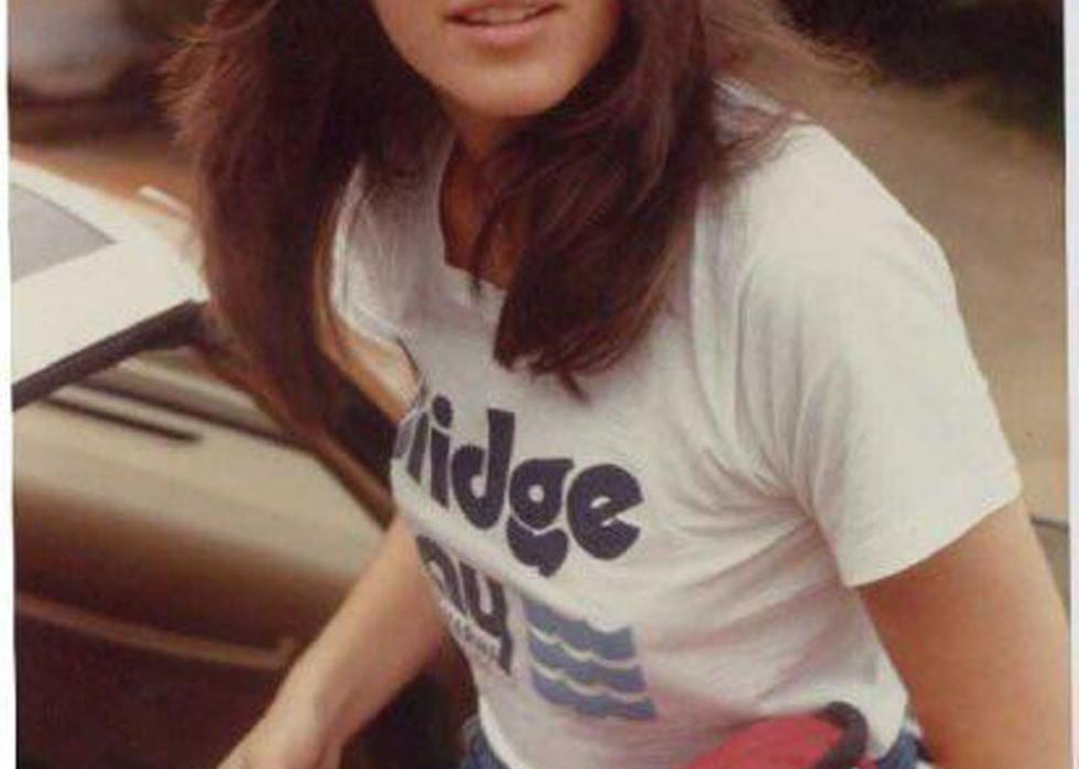 Woman with long hair and bangs in 1983