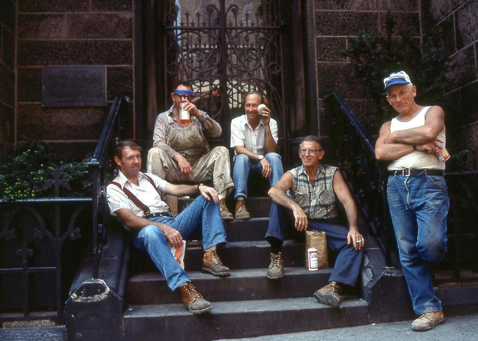 Group of 5 men hanging out on their lunch break