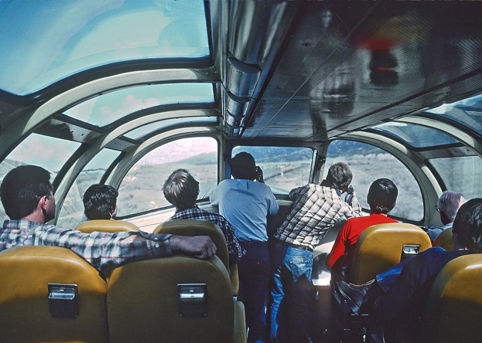Passengers starring out the windows of the dome car of the California Zephyr