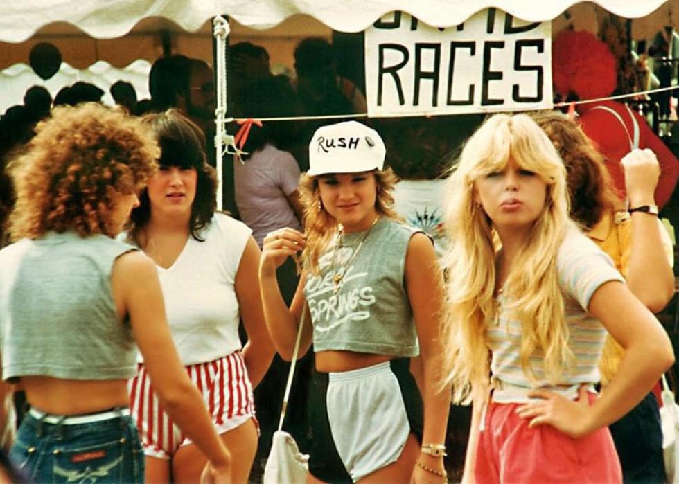 Four young women hanging out at a festival