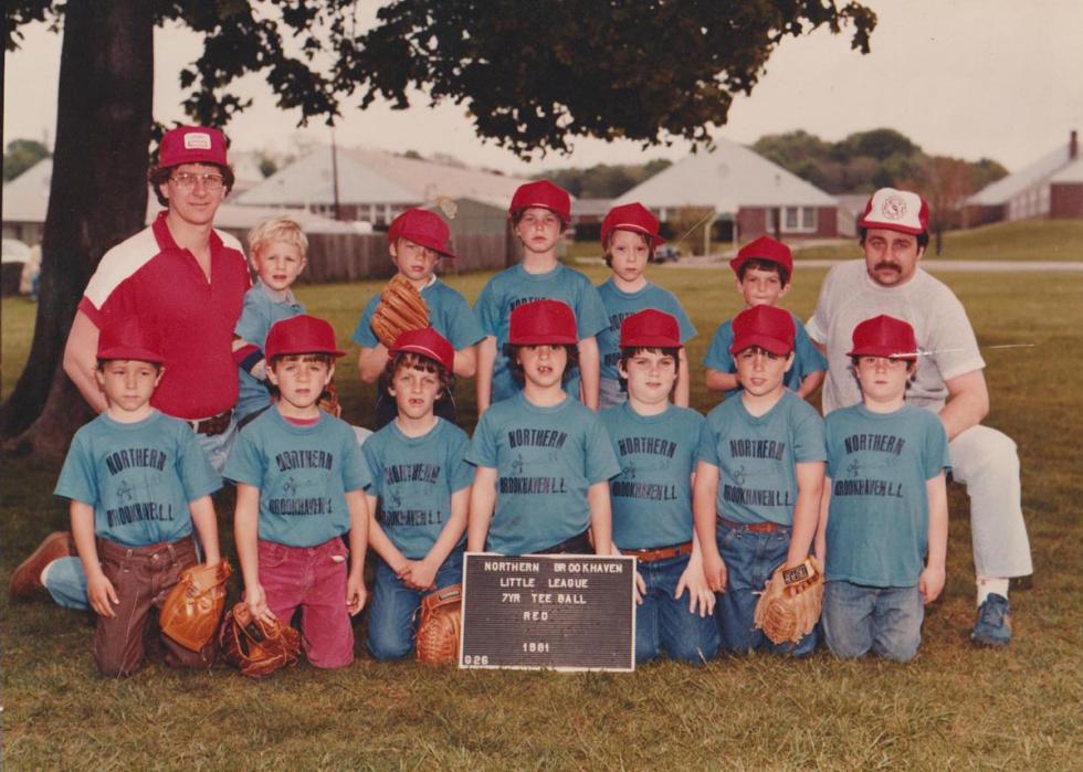 A group of kids and coaches posing for a team photo