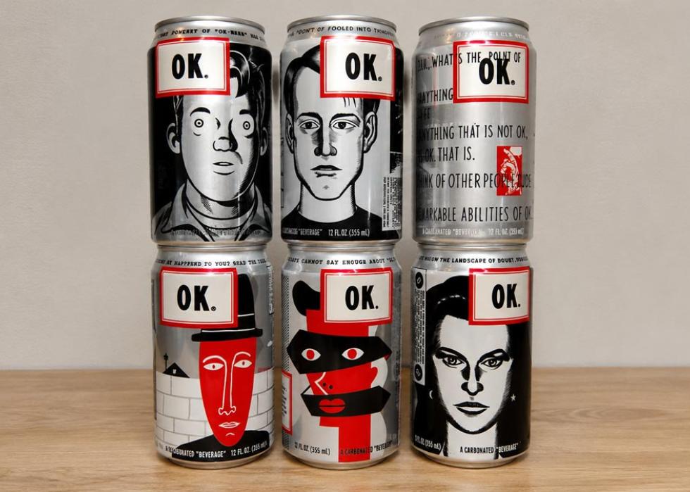 A collection of six cans of OK Soda