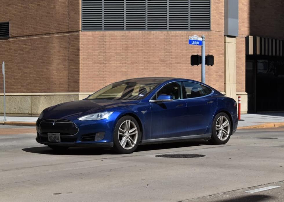A blue Tesla Models 4DR luxury EV sedan.