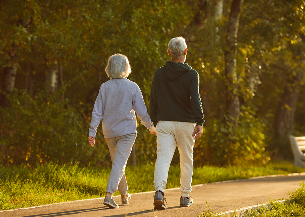 Couple walking in park.