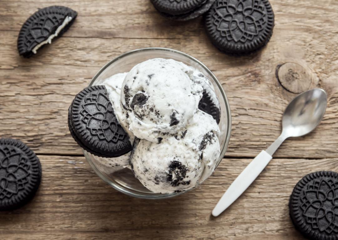 Cookies and cream ice cream bowl on wooden background.