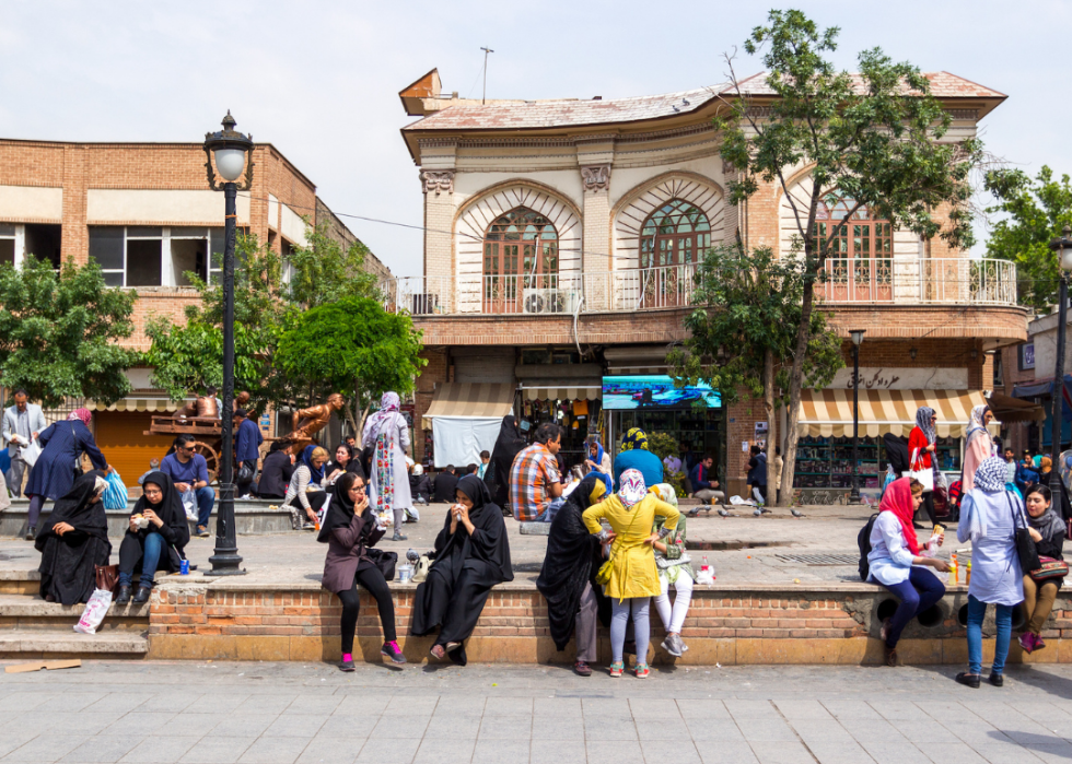 People gather in a urban park on the streets of Tehran