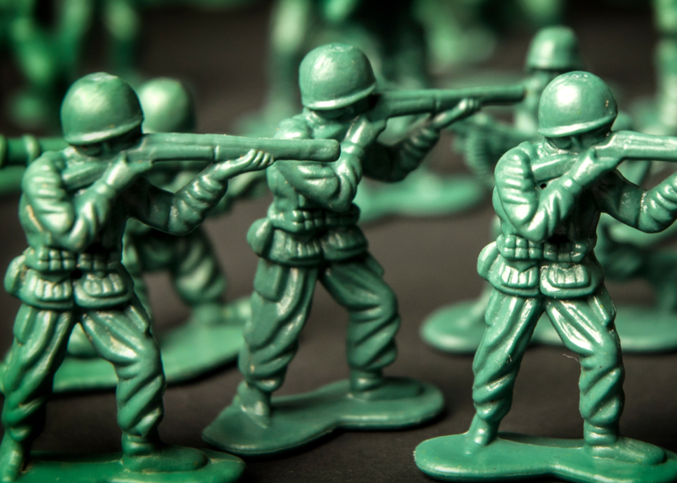 Cropped shot of plastic green army men toys.