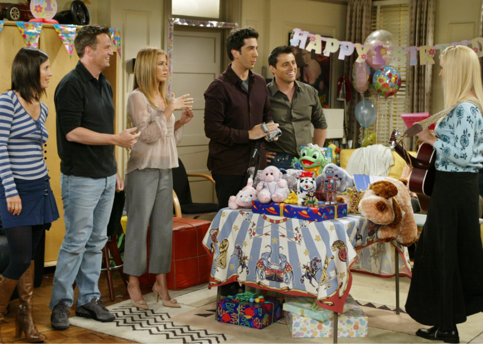 The cast of 'Friends' filming one of the final episodes where they throw Emma a first birthday party.