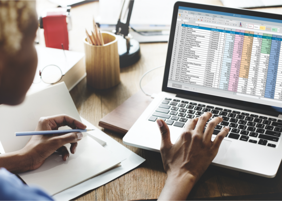 A woman looking at a spreadsheet.