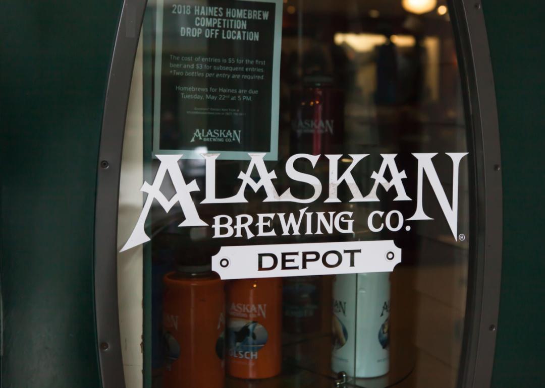 Alaska Brewing Company Depot logo on glass door.