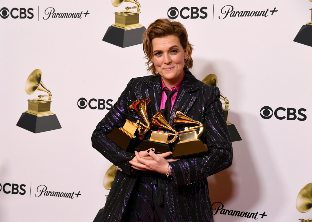 Brandi Carlile poses with Grammy Awards.