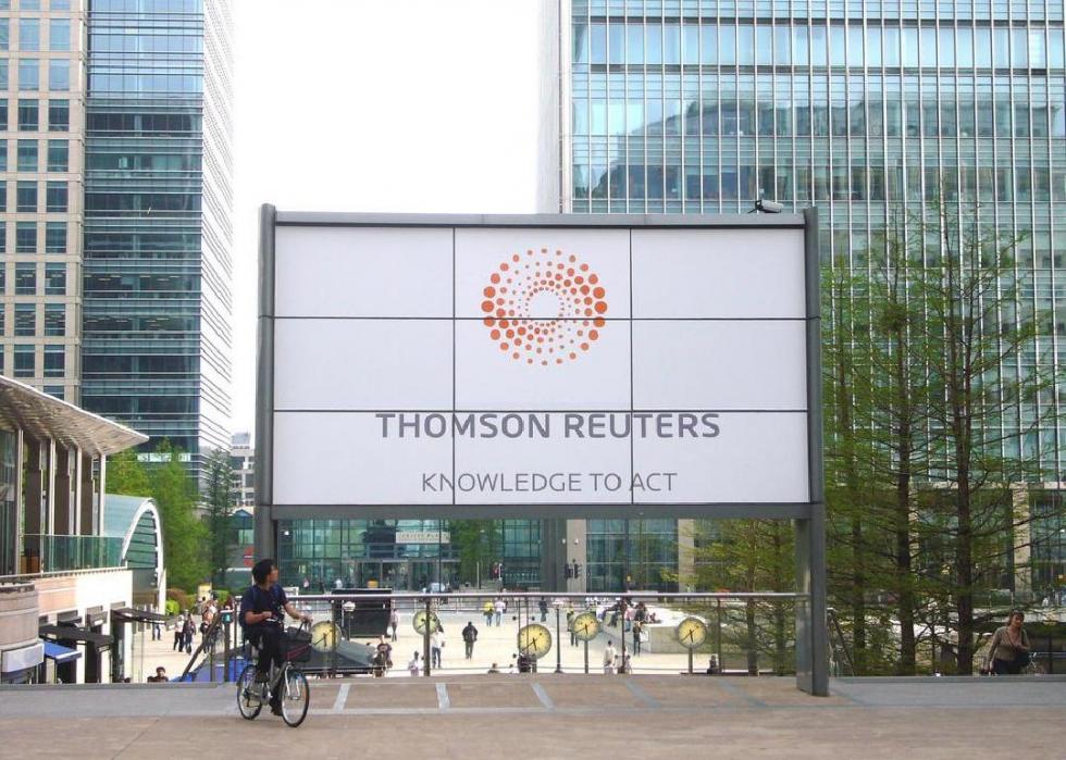 Sign bearing Thomson Reuters logo.
