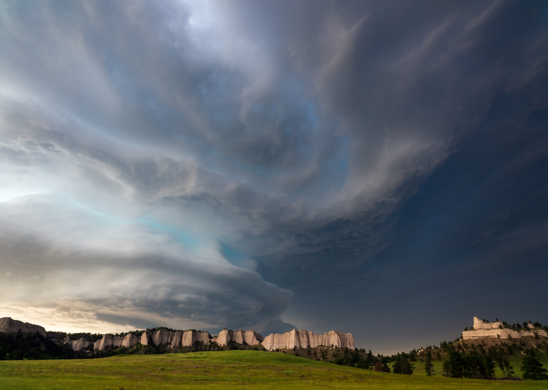 Supercell storm over landscape.