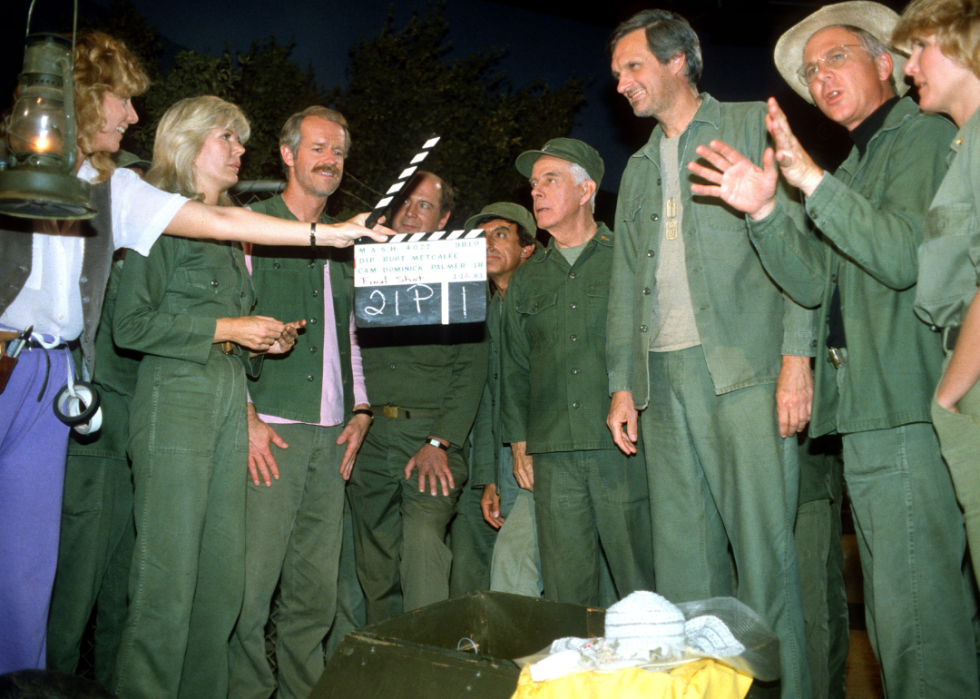 The cast and crew filming the final episode of MASH.