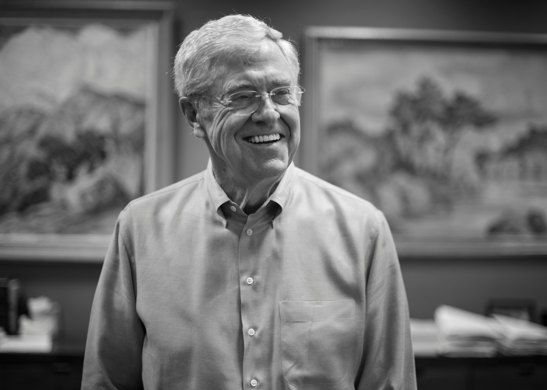 Charles Koch poses for a photograph in his office