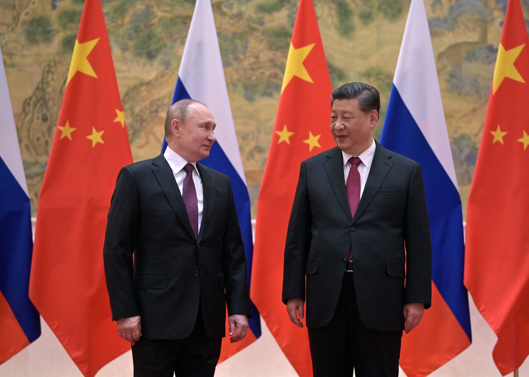 Vladimir Putin and Xi Jinping pose during their meeting in Beijing