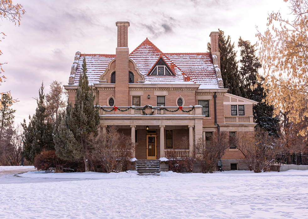 Kendrick Mansion in December snow decorated for Christmas.