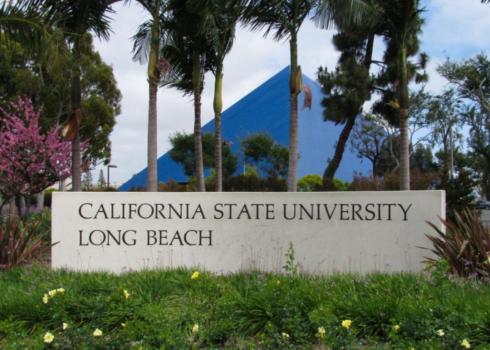 Entrance sign and view of Walter Pyramid sports arena.