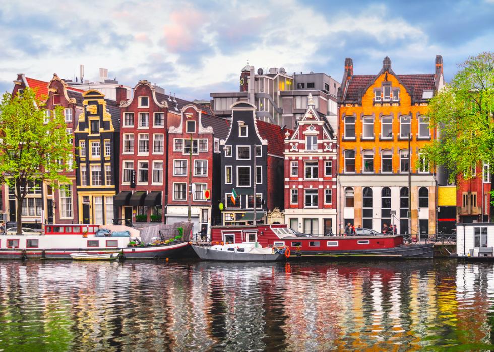 Waterview of houses in Amsterdam during springtime.