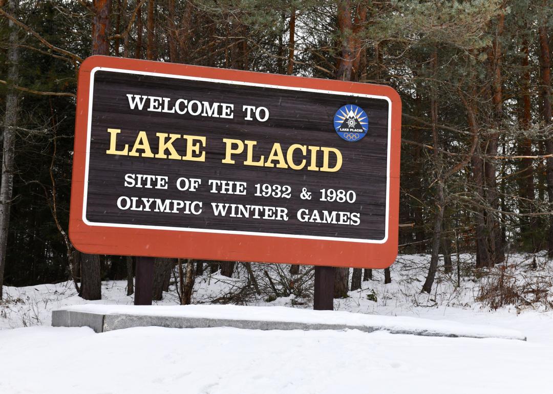 Lake Placid village sign in snow