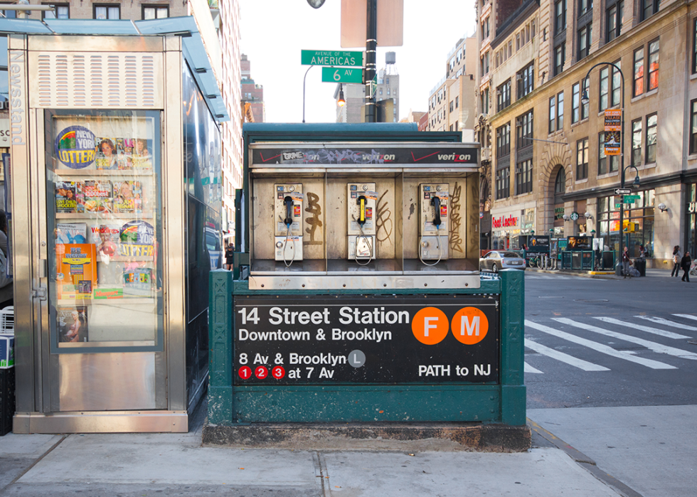New York City subway station entrance at 14th Street with pay phone.