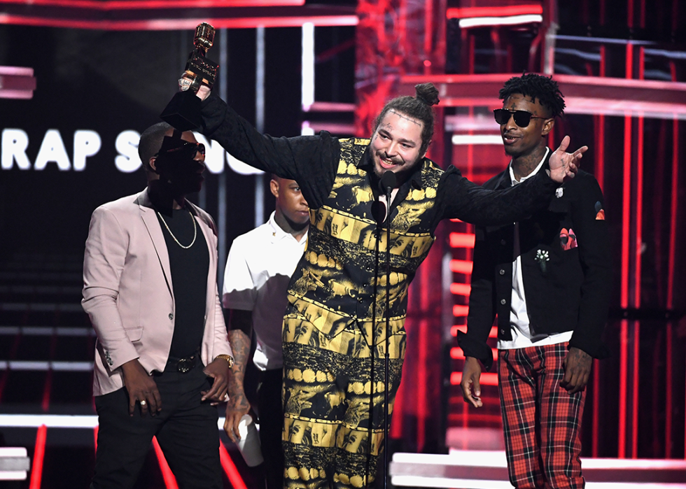 Post Malone and 21 Savage accept an award during the 2018 Billboard Music Awards.