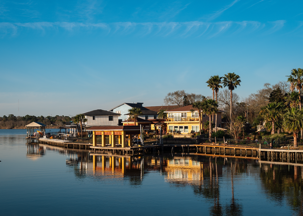 View of waterfront houses before sunset in Taylor Lake Village.