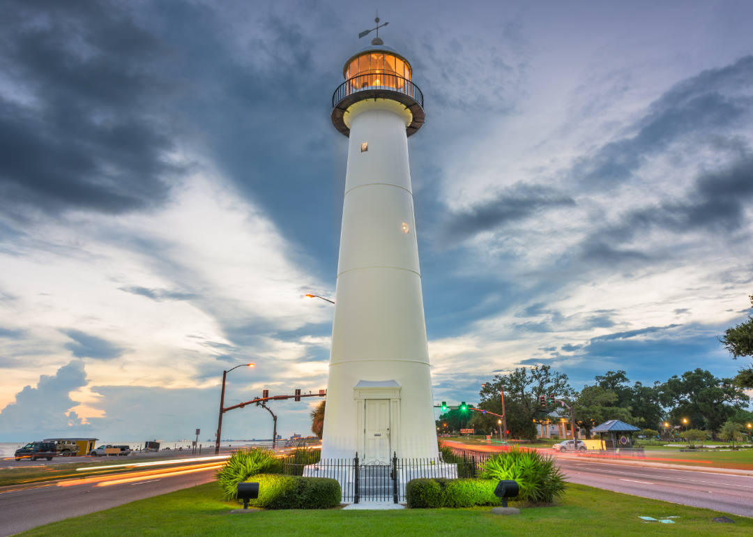 Biloxi lighthouse under cloudy skies.