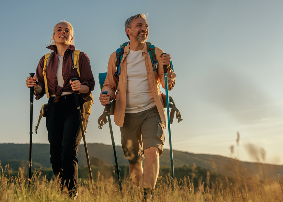 Couple hiking on rural trail.