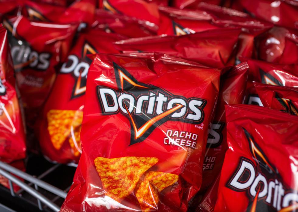 Doritos tortilla chips bags on shelf.