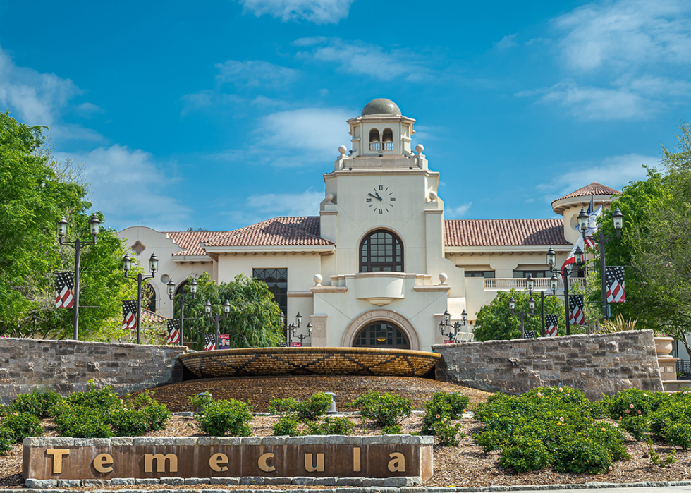 Old Town neighborhood with sign and clock tower building.