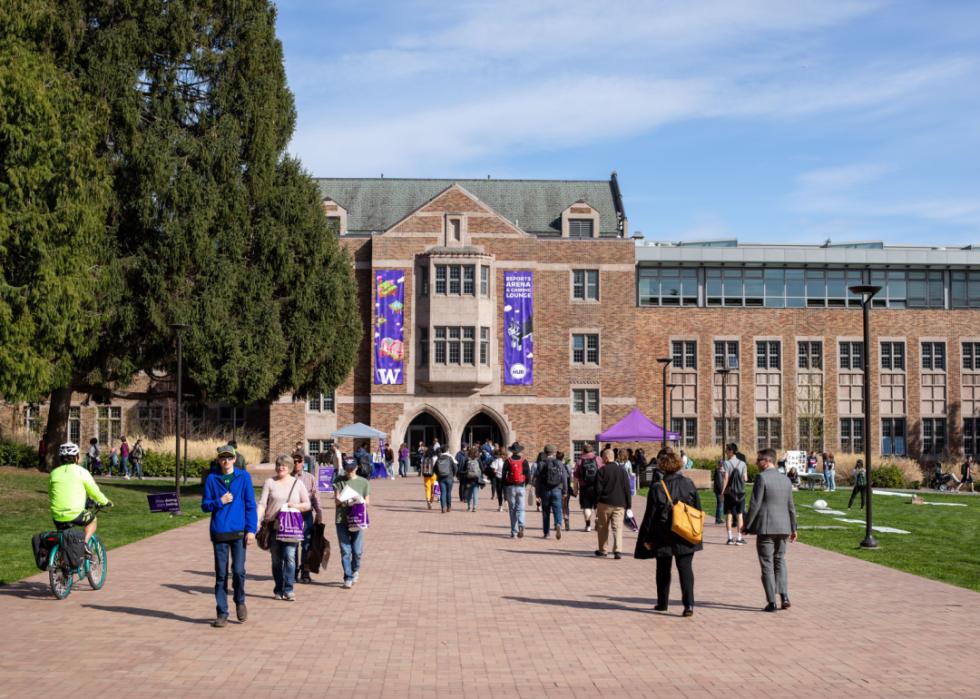 Students walking on the quad outside of The Hub Student Union Building.