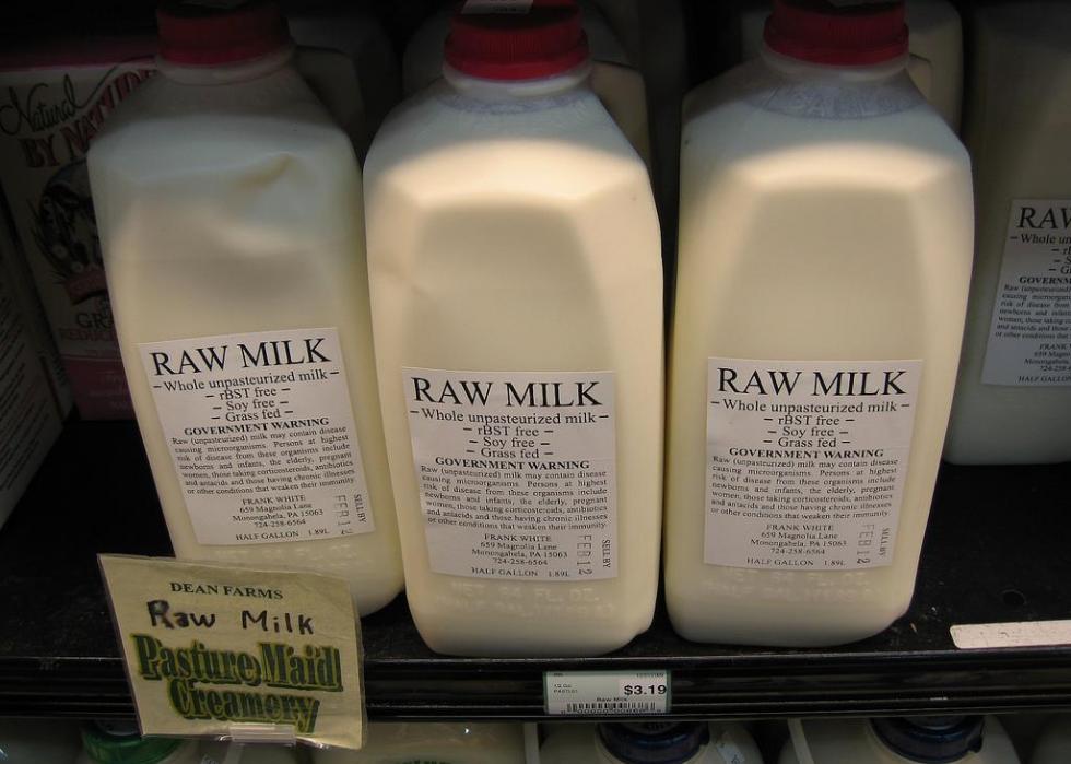 Rows of raw milk in a refrigerator.